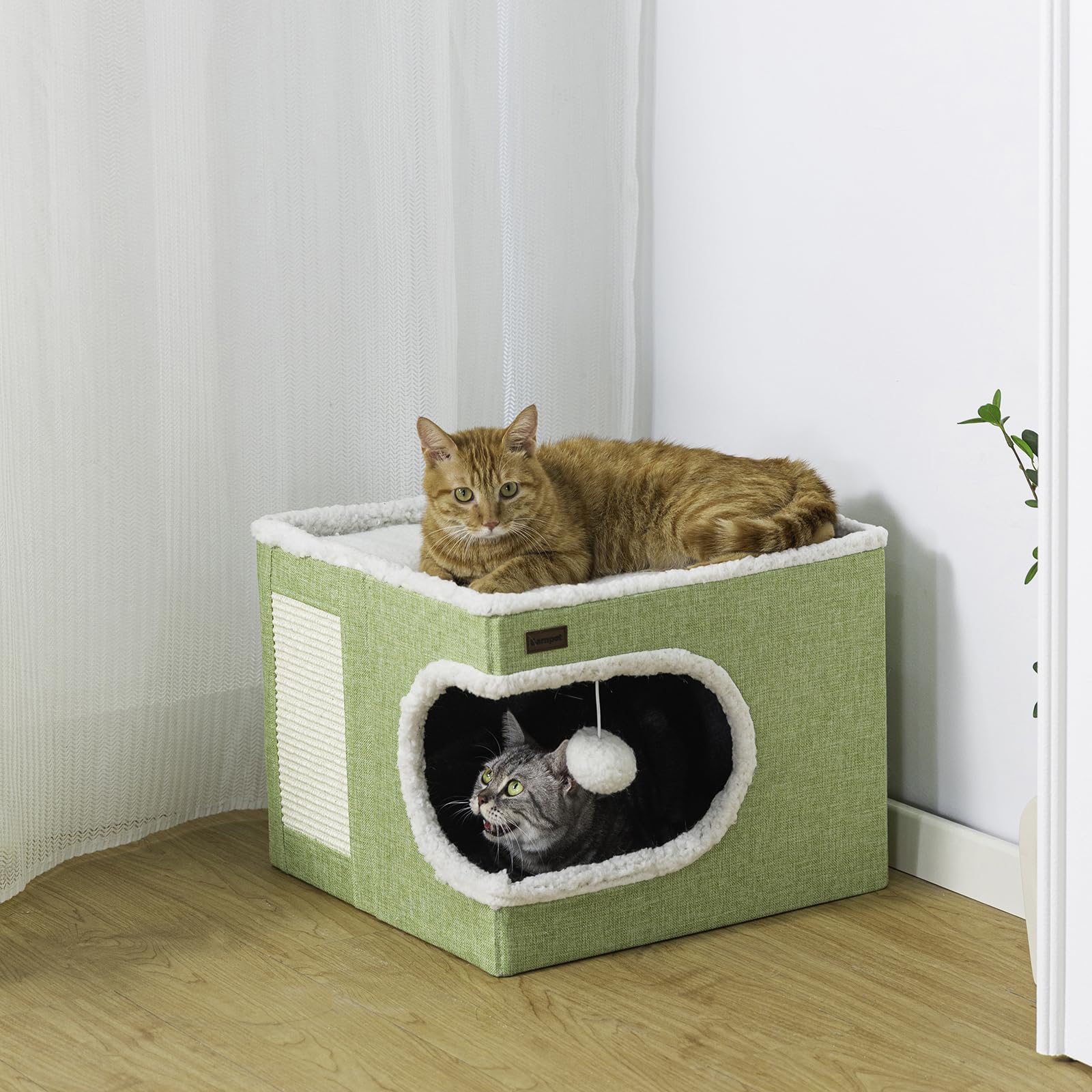 Garnpet cat bed closeup showing cave entrance and plush interior for snuggle times.