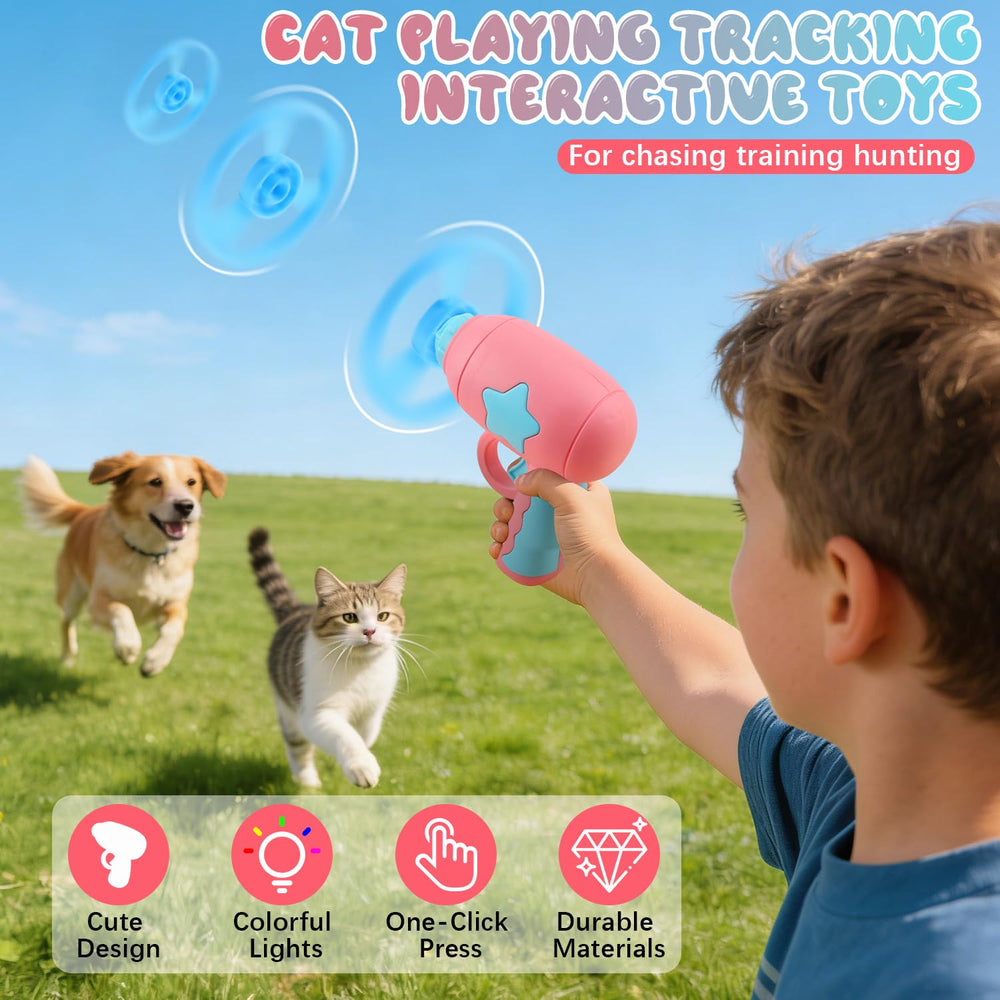 Cat interacting with pink launcher outdoors for exercise and fun.