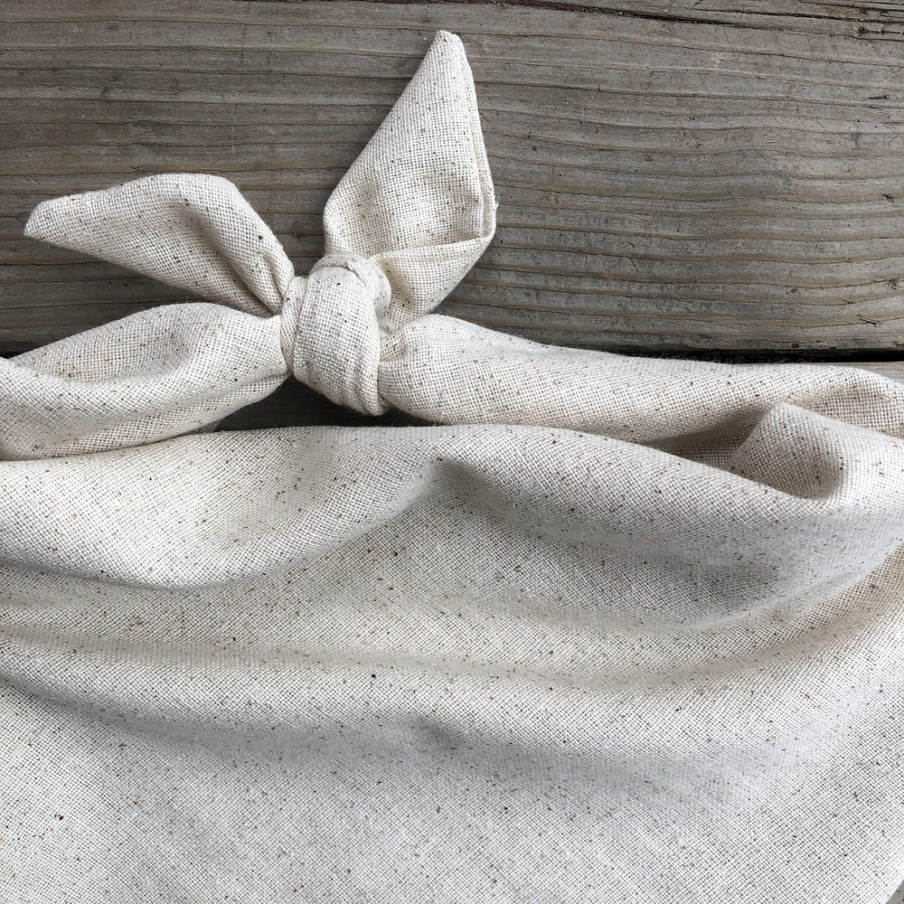 Generic Dog Bandana in oatmeal beige with reversible design for two looks.