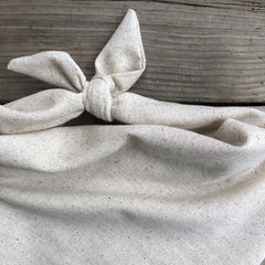 Generic Dog Bandana in oatmeal beige with reversible design for two looks.