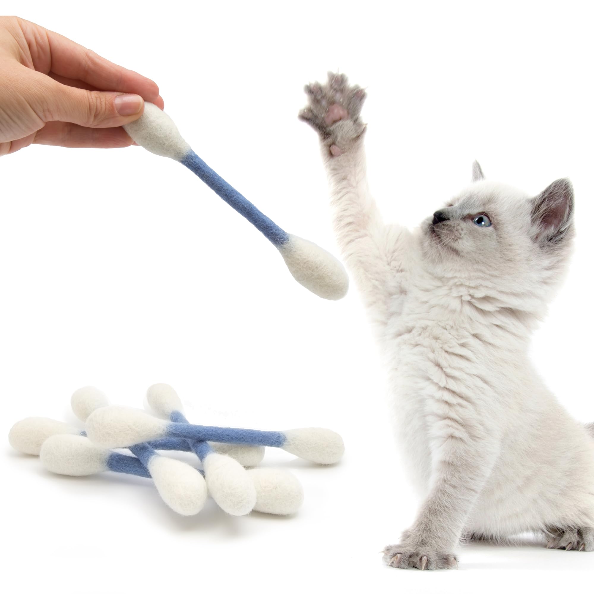 Cat playing with Glaciart One Swabs catnip toy in a living room