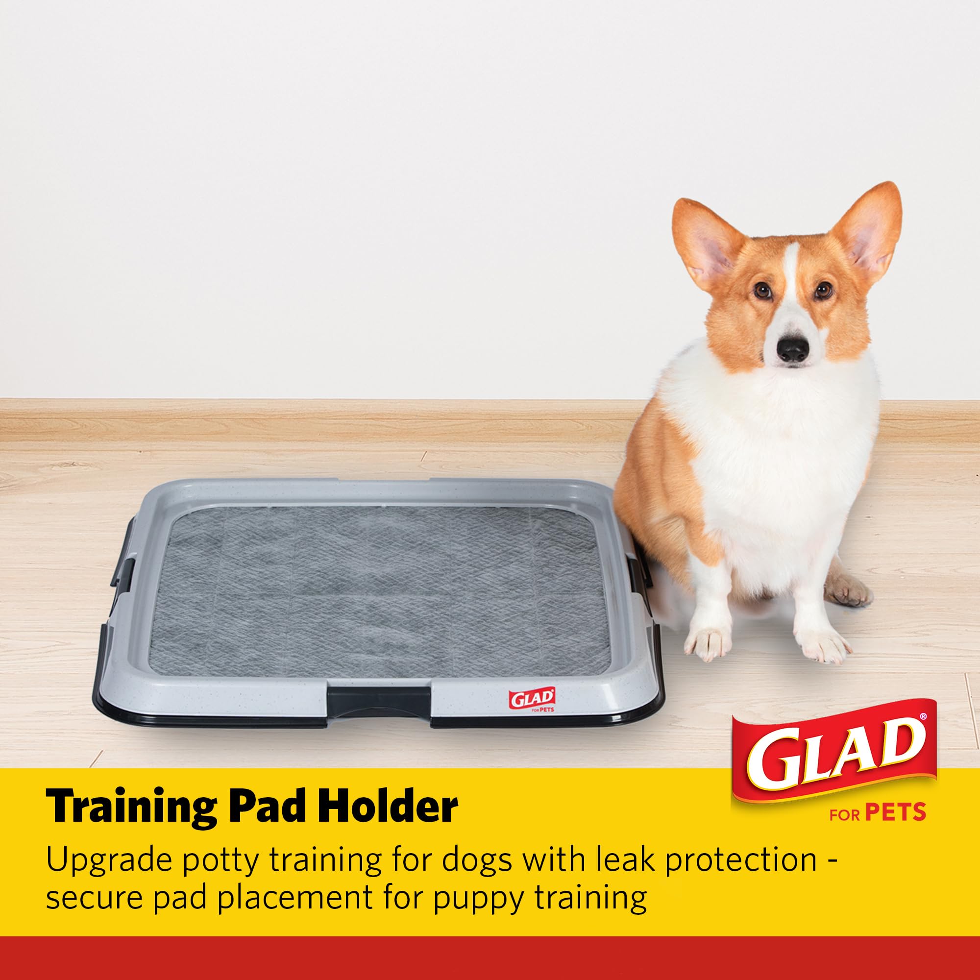 Glad dog potty tray with latches secures pads during active puppy training.