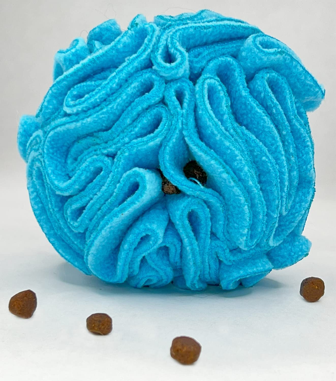 Glory To Dog snuffle ball with treats inside demonstrates interactive foraging for dogs.
