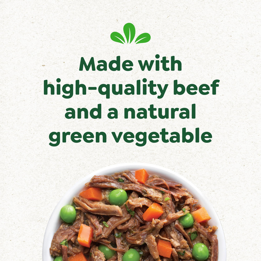 Happy dog savoring mealtime with Greenies Smart Topper topping.