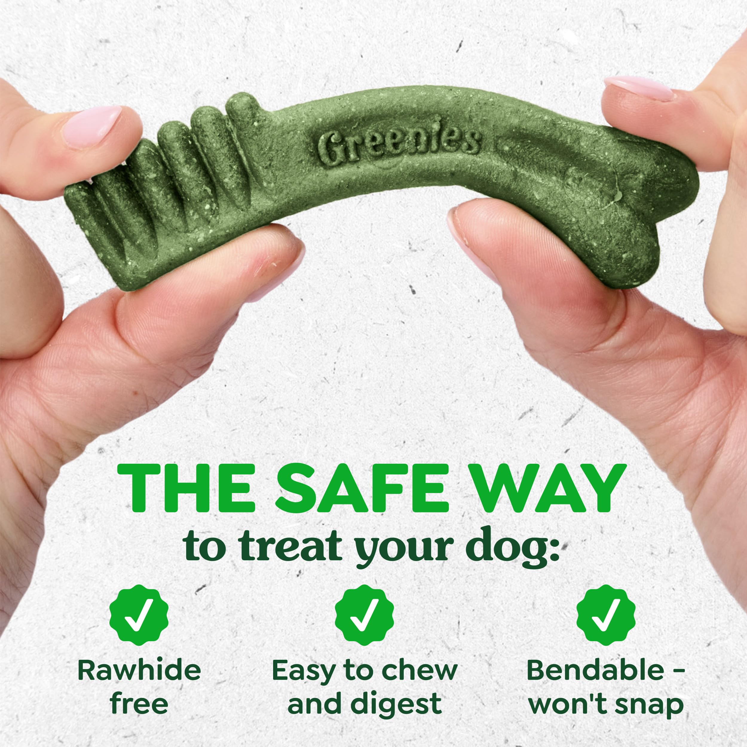 Greenies teenie-size chew held in hand for tiny breeds, simple daily treat.