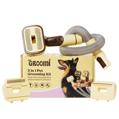 The Groomi 3-in-1 vacuum pet brush kit in use on a dog.