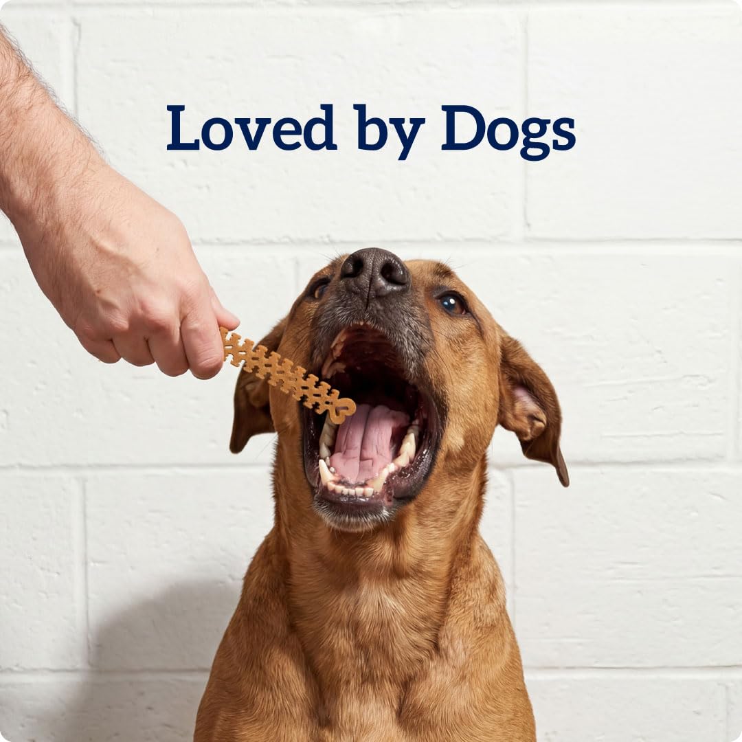Groovies natural chicken flavor close-up appeals to dogs during chew.
