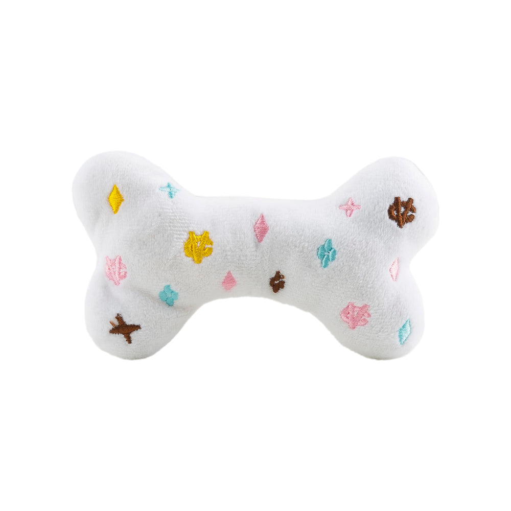 Close-up of Haute Diggity Dog Chewy Vuiton Bone toy squeaker inside for interactive play