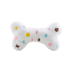 Close-up of Haute Diggity Dog Chewy Vuiton Bone toy squeaker inside for interactive play