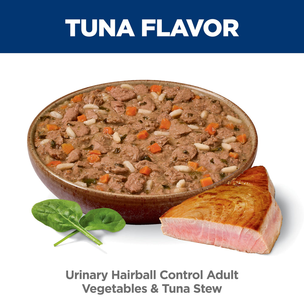 Cat enjoying Hill's Science Diet Urinary Hairball Control wet food from bowl.