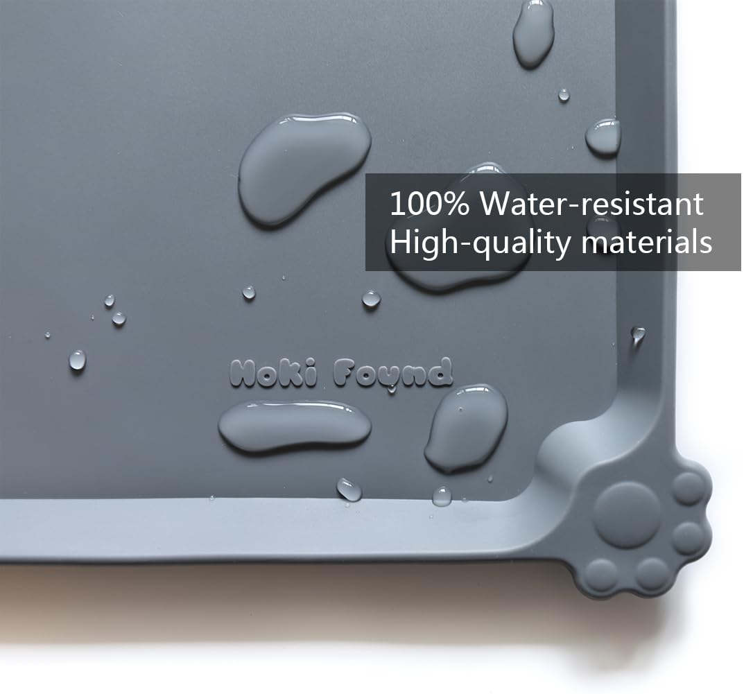 Hoki Found extra-high edge mat contains crumbs and water at feeding time