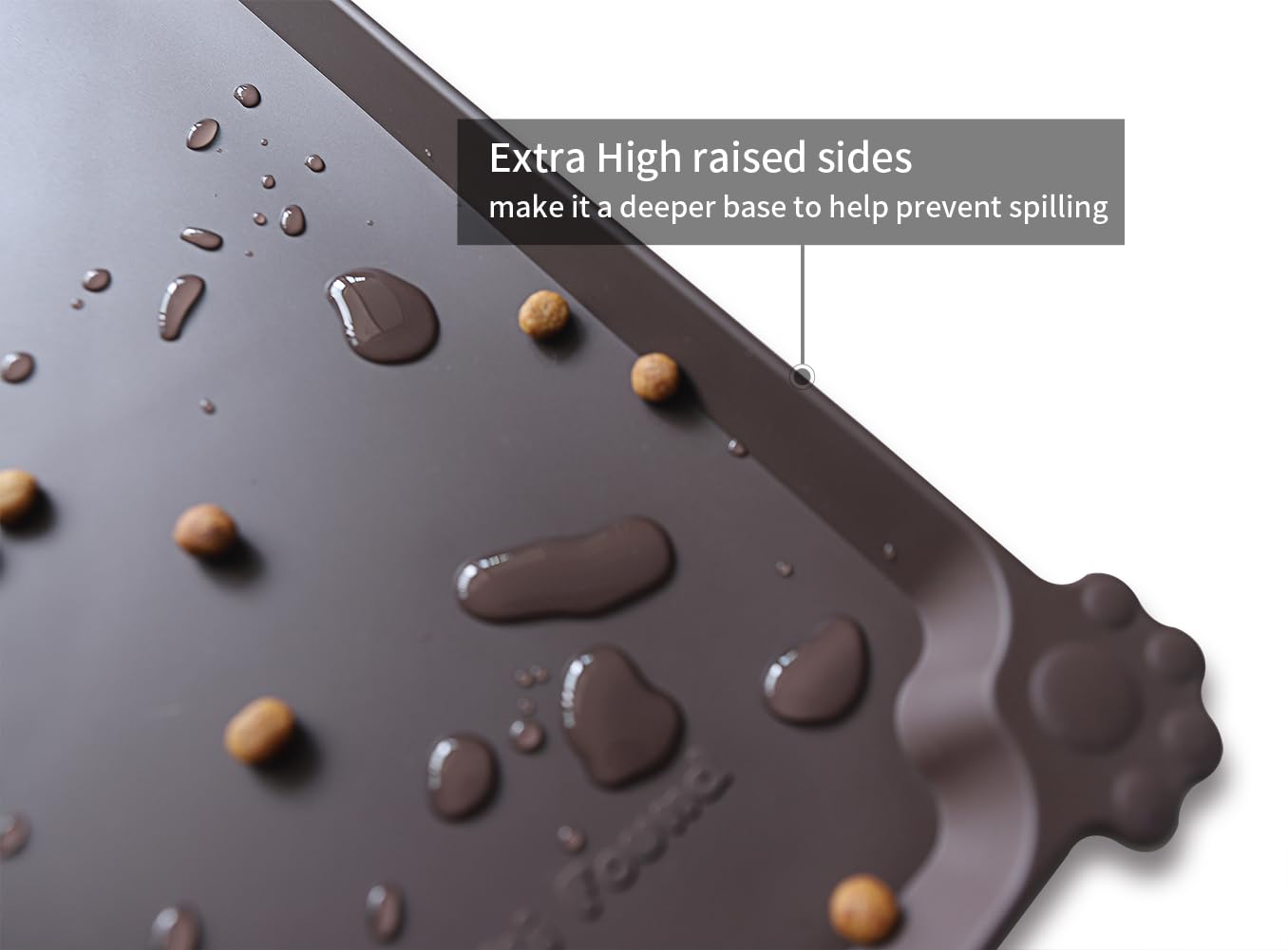 Hoki Found L pet mat with raised edge catches crumbs and water for easy cleanup.
