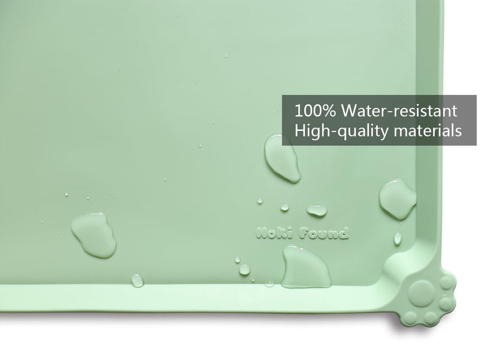 Hoki Found L raised-edge mat contains spills on carpets and floors.