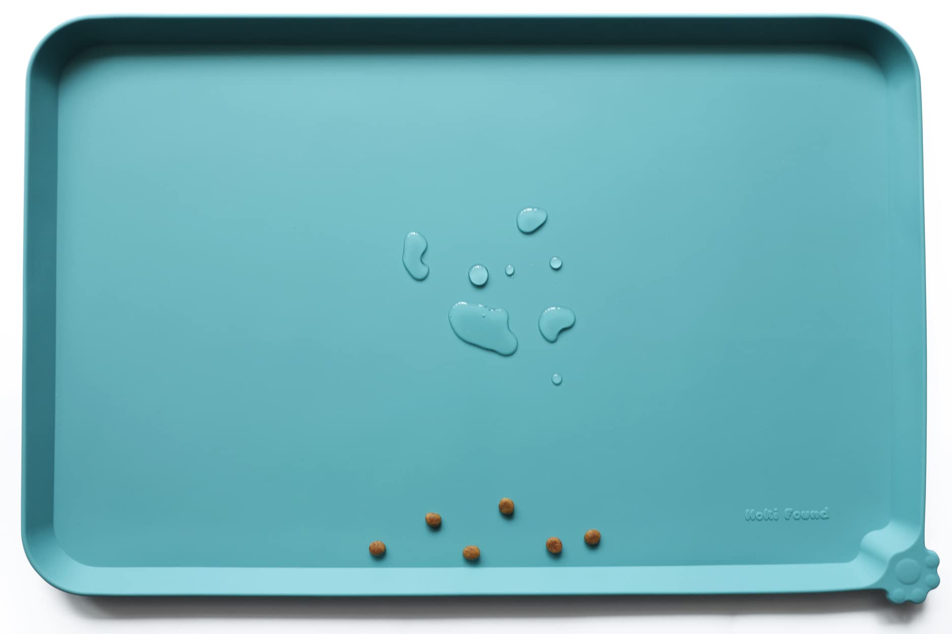 Hoki Found Glacier silicone mat protects floors during pet feeding.