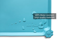 Hoki Found Glacier raised-edge mat contains spills and crumbs.