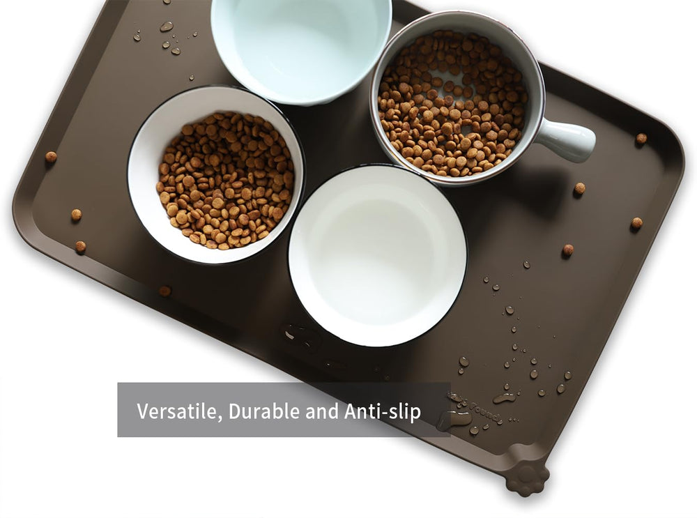 Hoki Found L silicone mat features an extra-high edge to contain spills.