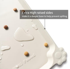Hoki Found 24-inch by 16-inch mat with extra-high lip contains water and food during meals.
