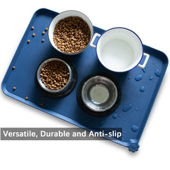 Hoki Found raised-edge pet mat in indigo-ink design contains crumbs and spills