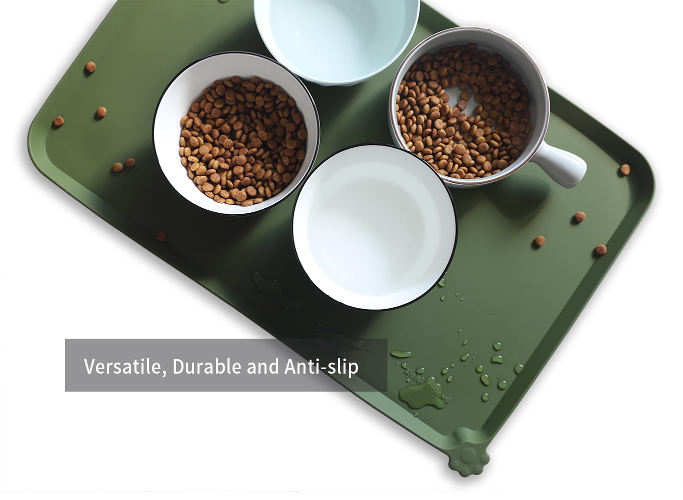 Hoki Found L dark olive mat protects floors and contains crumbs.