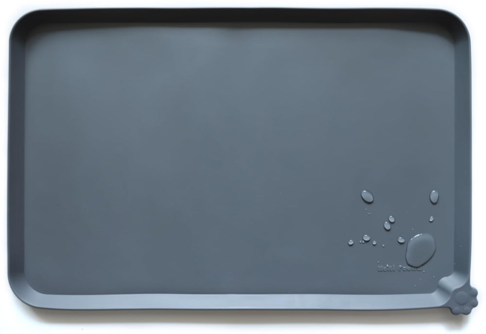 Hoki Found silicone pet food mat in gray with a non-slip surface for bowls.