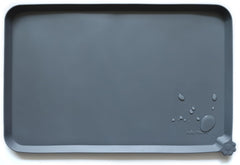 Hoki Found silicone pet food mat in gray with a non-slip surface for bowls.