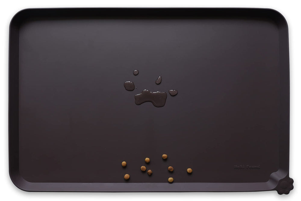 Hoki Found silicone pet food mat with high lip keeps spills away from floors.