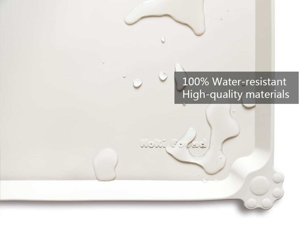 Hoki Found waterproof pet mat in cream is easy to wipe clean after meals.