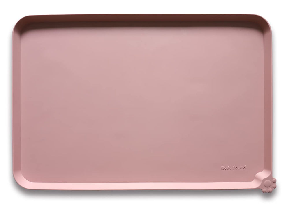Hoki Found large non-slip mat with raised edge prevents spills.