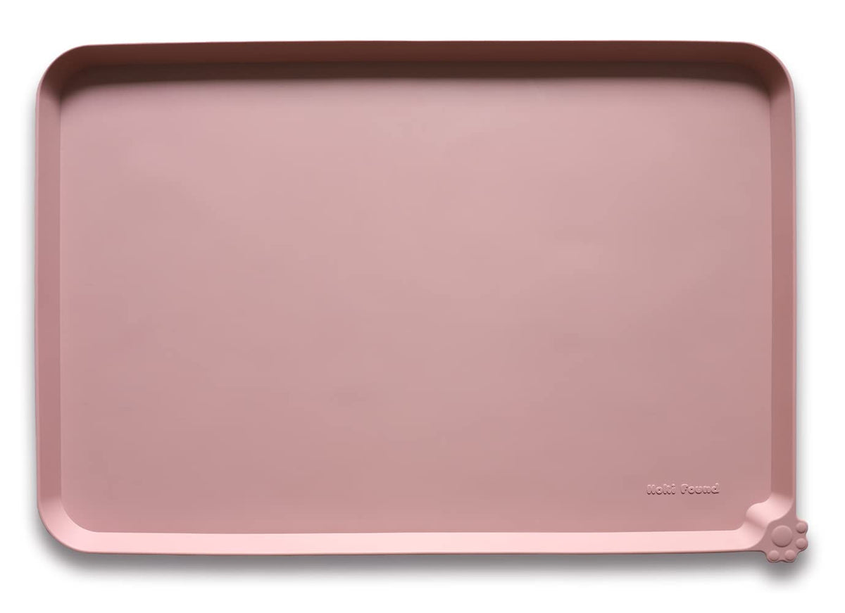 Hoki Found large non-slip mat with raised edge prevents spills.