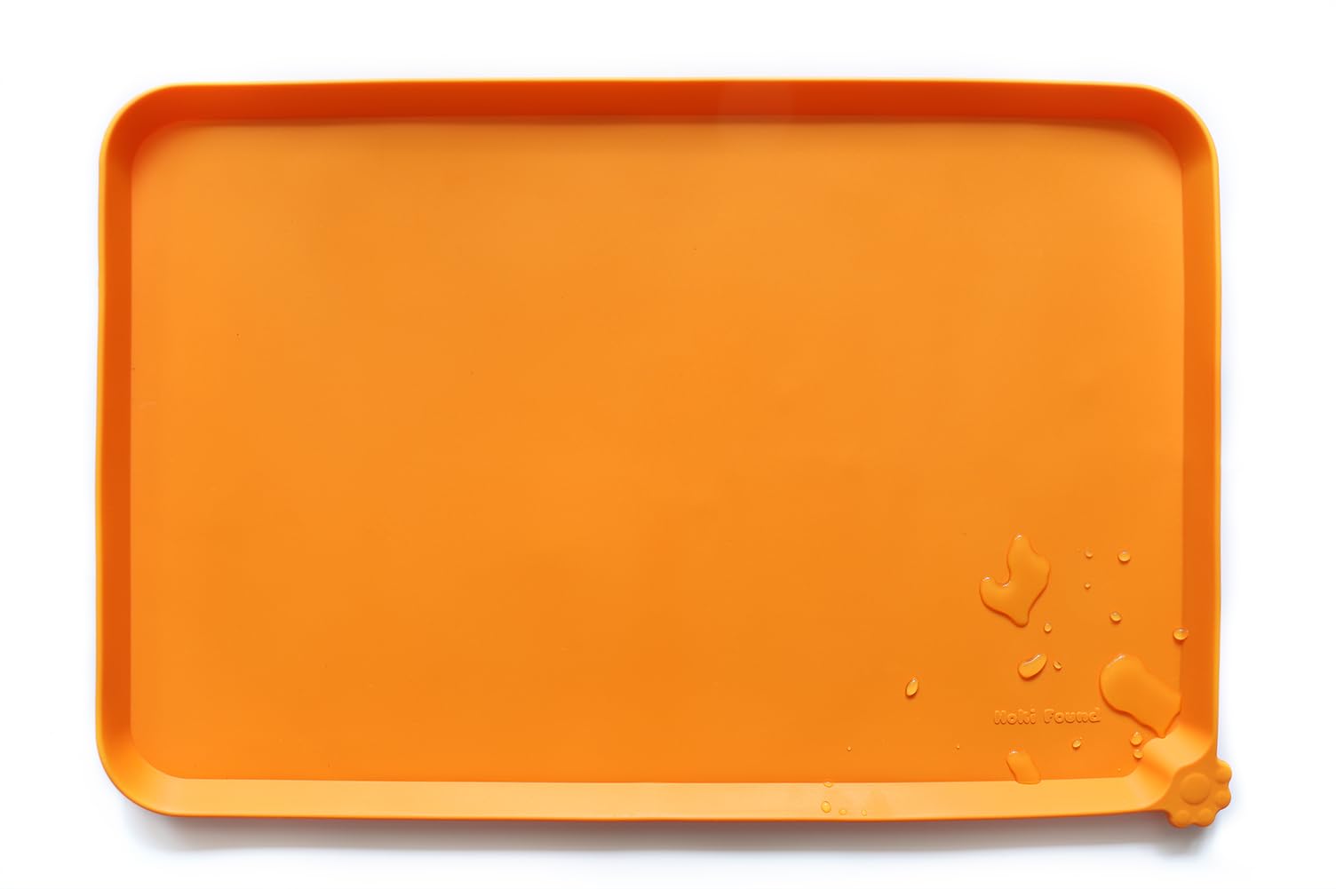 Hoki Found silicone non-slip pet feeding mat in orange helps keep meals mess-free.