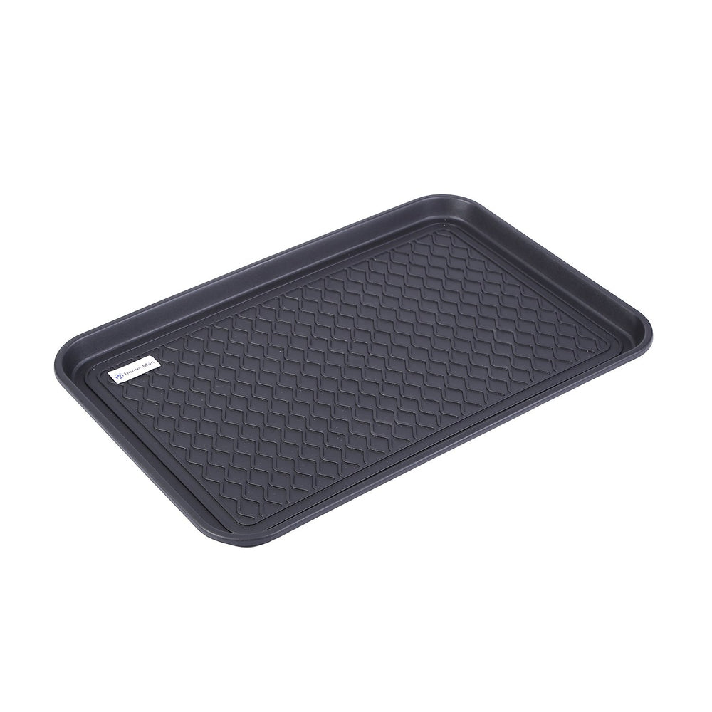 Home-Man boot tray mat being rinsed for easy cleaning after use