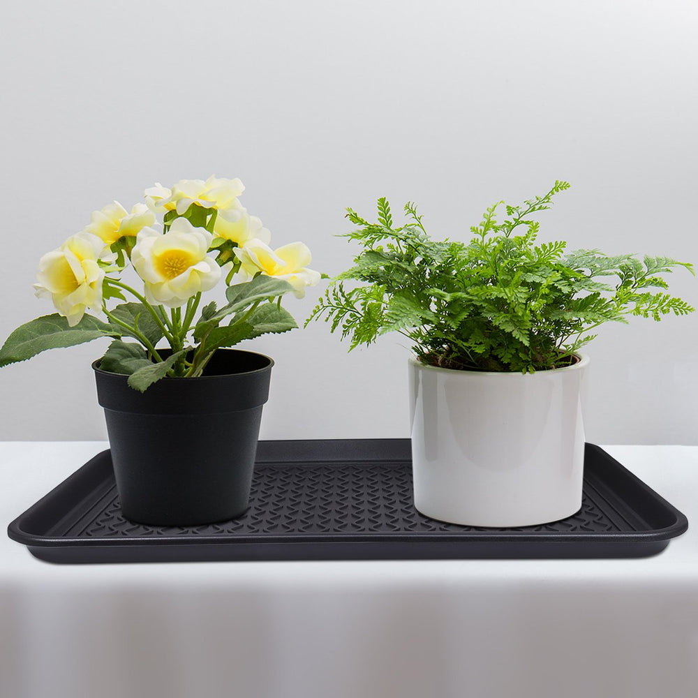 Home-Man raised-edge design contains spills and debris