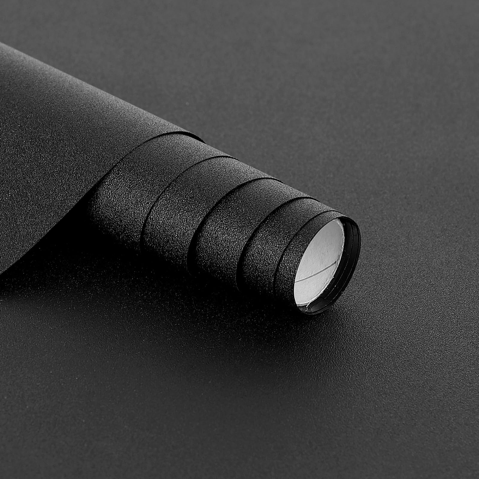 Hygger CO2 backdrop in black rolled for clean aquarium aesthetics and easy installation.