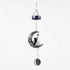 iHeartDogs iron crescent moon design shows pawprints and stars in a touching outdoor display