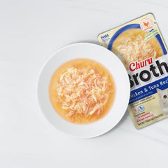 INABA Churu broth toppers with salmon flakes introduce richer flavor to cats.