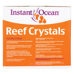 Measuring cup shows dosing for reef tanks with Instant Ocean Reef Crystals.