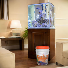 Instant Ocean Reef Crystals reef tank setup scene suggests simple top-off mixing.