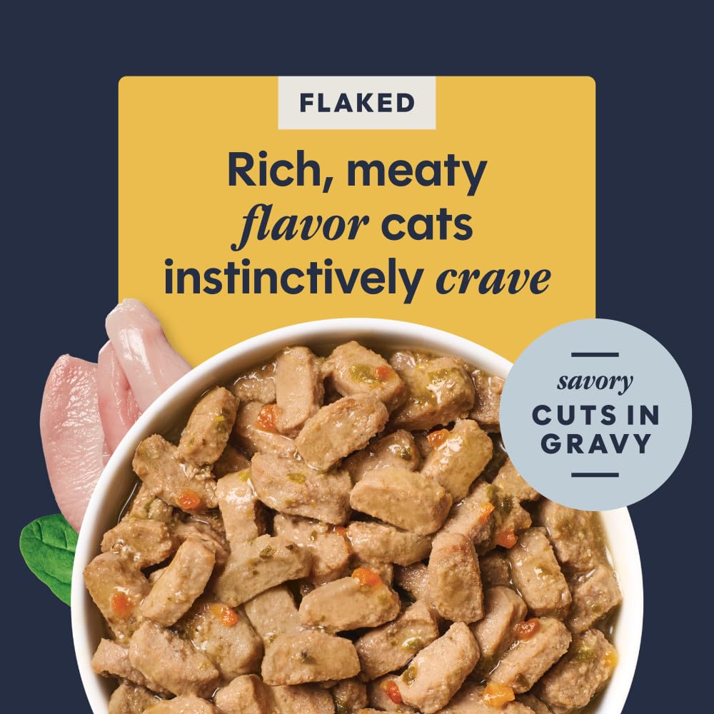 Instinct Flaked Entrée Chicken ingredients carrots and spinach visible for natural nourishment.