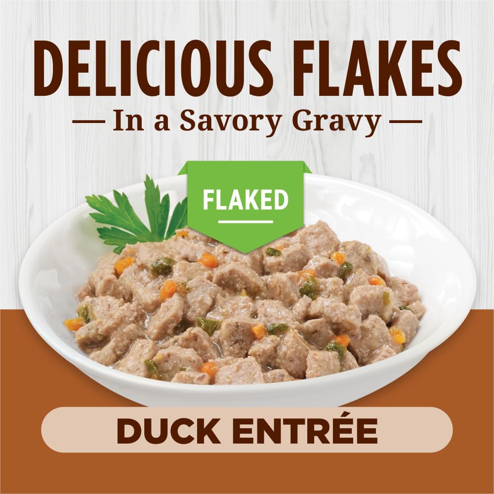 Instinct Flaked Entrée Duck can shows ingredients visible like carrots and spinach for natural nourishment