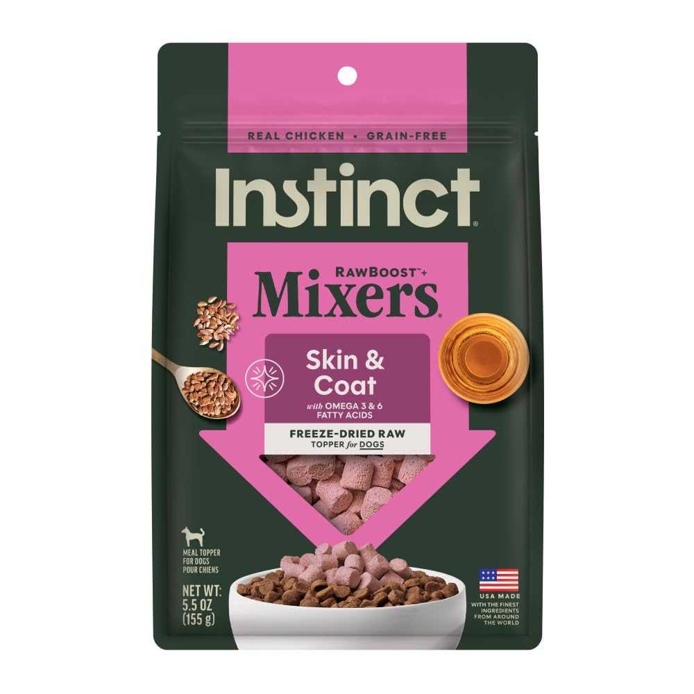 Instinct RawBoost mixers chicken chunks over a bowl for flavorful nutrition