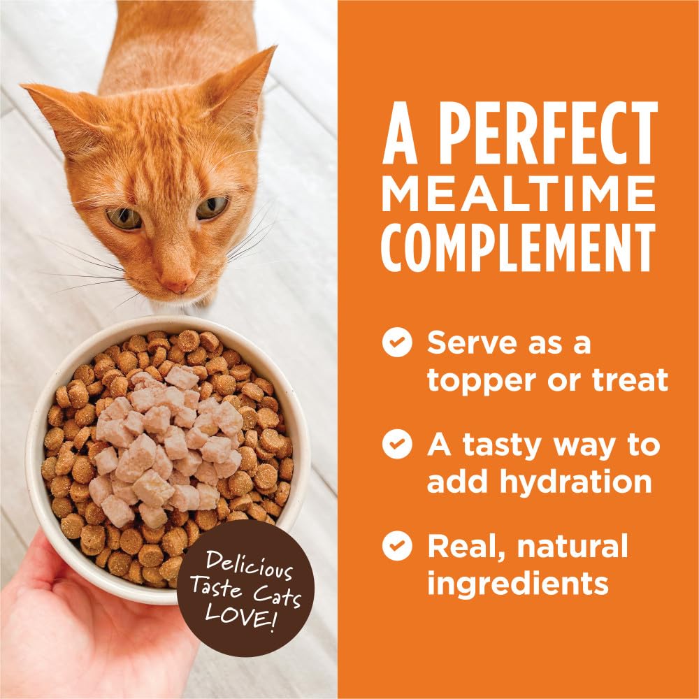 Cat savoring Instinct tuna toppers as a flavorful meal topper