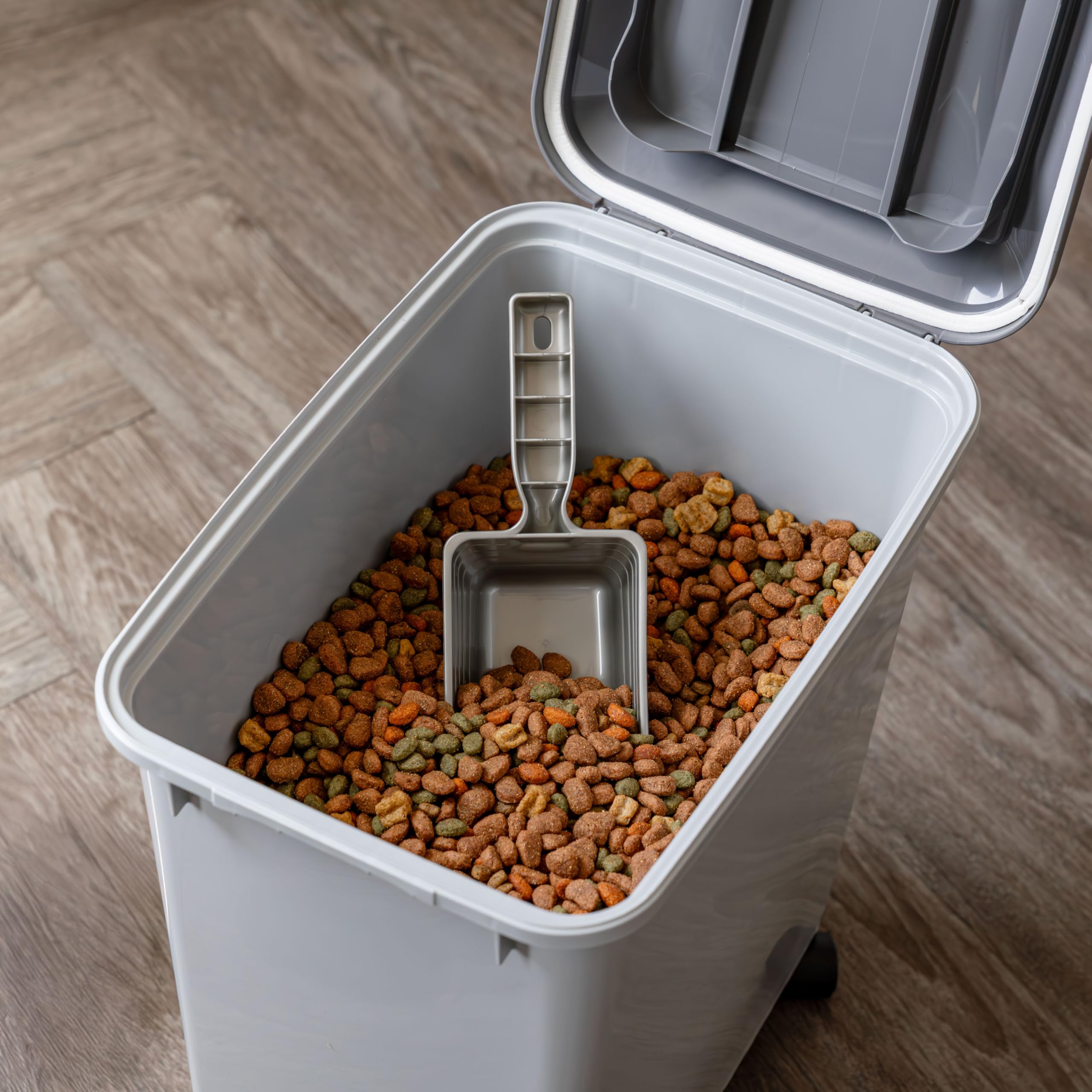 IRIS USA two-cup scoop included for precise pet feeding portions.