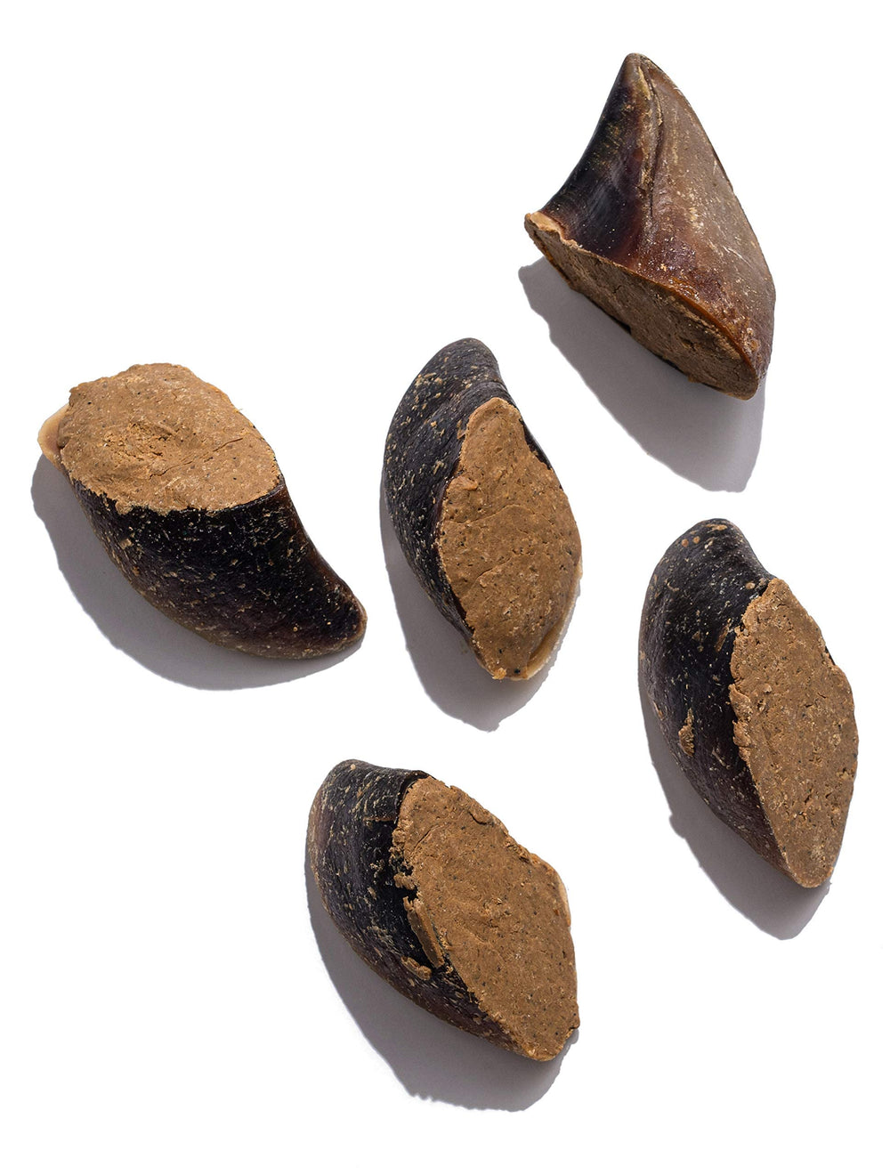 Closeup of bacon and cheese filling inside a Jack&Pup cow hoof chew.