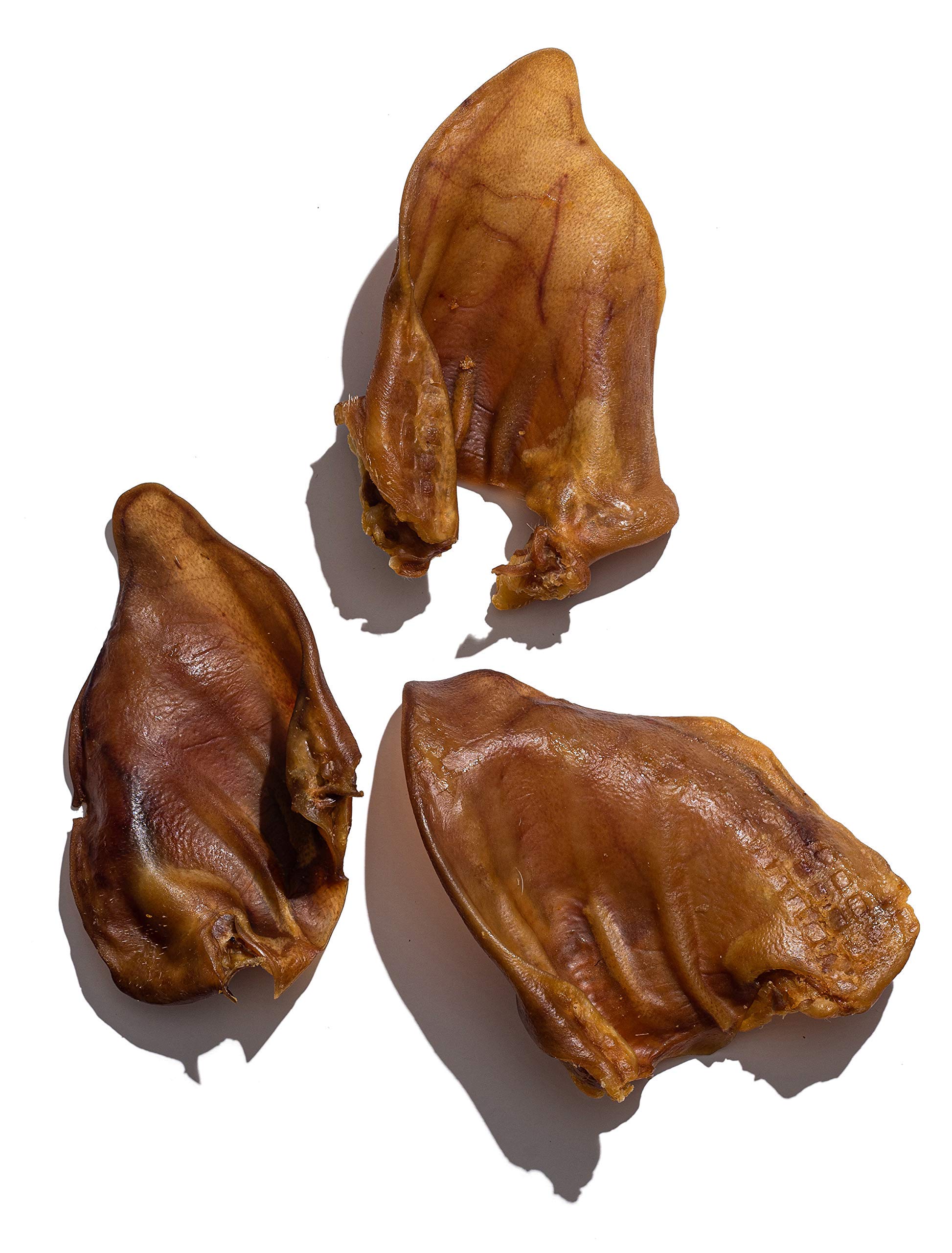Jack&amp;Pup Whole Pig Ears 10 Pack — uncooked close-up showing thick, natural chew.