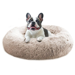 JOLLYVOGUE calming dog bed 36-inch donut shows plush faux fur for cozy rest.