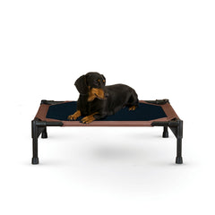 K&H Pet Products outdoor elevated dog cot side view for small dogs staying off warm ground