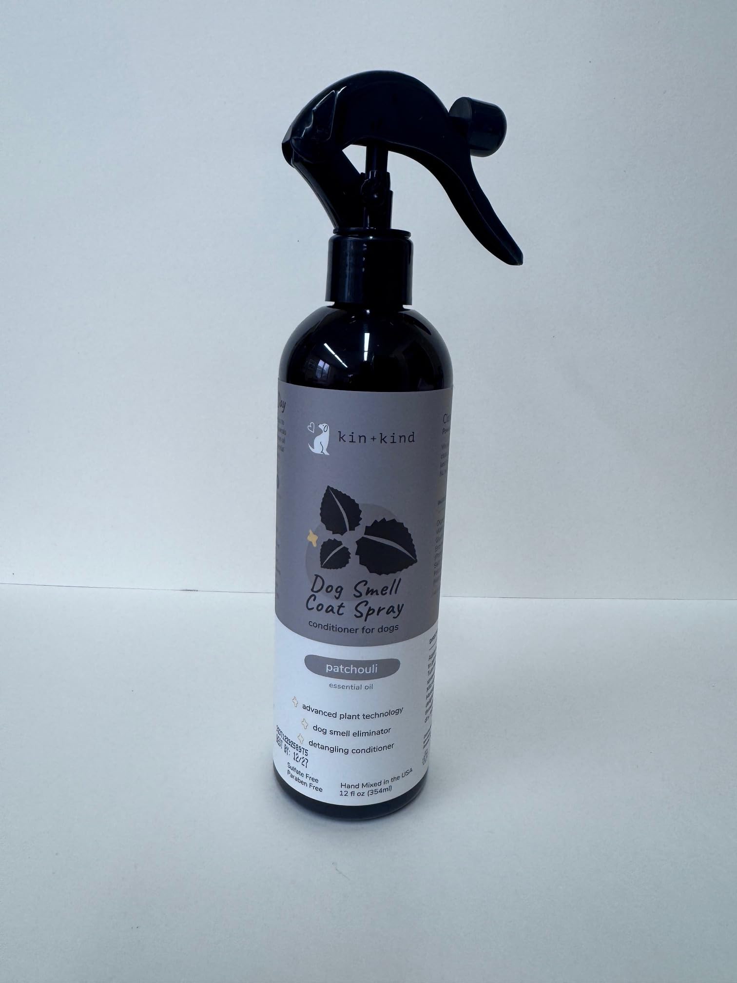 kin+kind USA-made bottle pictured in a cozy grooming setup