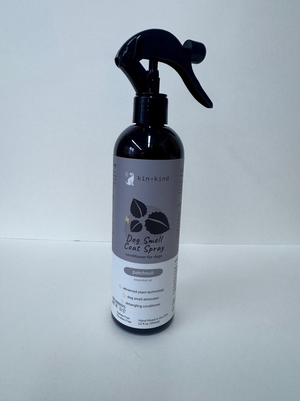 kin+kind USA-made bottle pictured in a cozy grooming setup