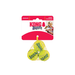 KONG Squeakair Ball being retrieved in a sunny yard.