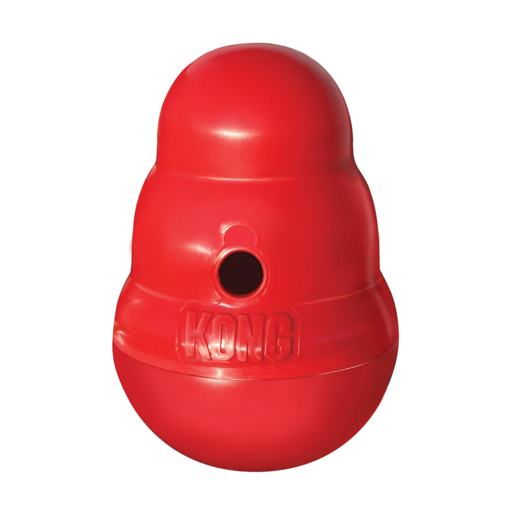 KONG Wobbler in action, engaging dogs with interactive treat dispensing during snack time.